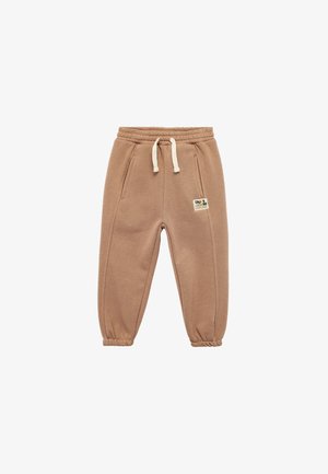 Beige Jogginghose aus weichem Stoff, mit einem elastischen Bund mit Kordelzug, Seitentaschen und elastischen Bündchen an den Knöcheln.