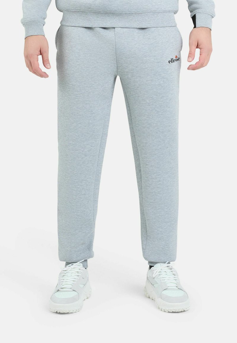 Grijze sweatpants van zacht materiaal, met een elastische taille, slim fit, zijzakken en een klein logo op de linker dij.