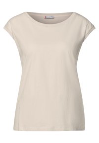 T-shirt beige a maniche corte con un ampio scollo rotondo, realizzato in morbido tessuto di cotone, caratterizzato da una vestibilità rilassata e dettagli di cucitura sottili.