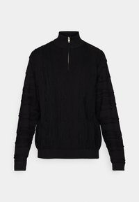 Black pullover sweater with a high collar and short zipper, featuring a textured knit pattern and ribbed cuffs and hem.