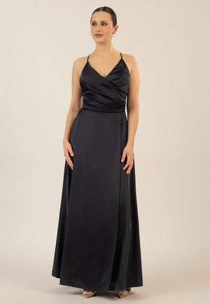 Long, dark satin dress with a wrap bodice and thin straps. The fabric has a smooth texture, and the skirt flows to the floor with a subtle sheen.