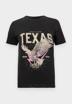 Must musta T-särk mustast puuvillast, millel on hawki graafika, julge tekst "TEXAS" kreemi- ning roosa värviga, välguteemalised kaunistused ja vintage disain.