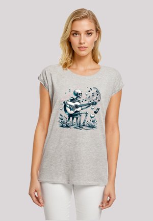 Gray short-sleeve t-shirt featuring a skeleton playing guitar with music notes and hearts, detailed illustration with floral accents.