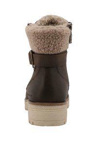 Bruine leren enkellaars met een gestructureerde beige wollen kraag, voorzien van een zijrits en een lichtgekleurde rubberen zool.