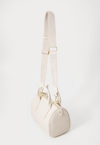 White leather handbag with rounded shape, dual handles, gold hardware, and a detachable strap featuring embossed logo detail.