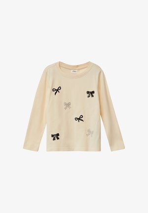 Light beige long-sleeve shirt with black and silver sequin bow appliqués. Features a round neckline and soft cotton material.