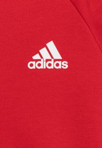 adidas Performance UNISEX jasnoczerwony