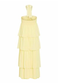 Robe maxi jaune clair à volants avec haut bandeau smocké et bretelles nouées autour du cou.