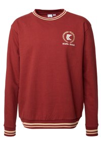 Felpa rossa a maniche lunghe con colletto, polsini e orlo a strisce beige, e logo Karl Kani sul lato sinistro del petto.