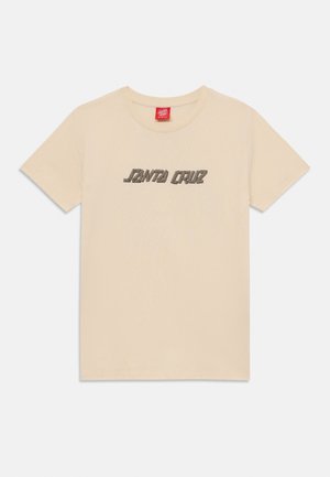 Beige T-shirt med korte ærmer og teksten "Santa Cruz" i en stiliseret, blokagtig skrifttype centreret på brystet.