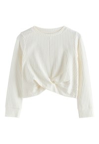 Haut blanc à manches longues côtelé avec un design torsadé à l'avant. Il présente un col rond et des poignets ajustés. Texture douce et longueur courte.