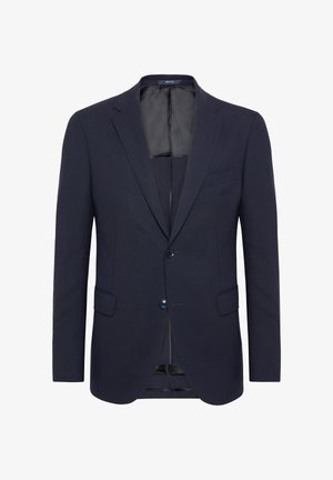 Tamsiai mėlynas švarkas, pagamintas iš lygaus audinio, su dviem mygtukais, notch tipo apykakle ir priekinėmis kišenėmis. Vidus išklotas juodu pamušalu.