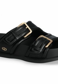 Black leather sandals with two wide straps, featuring gold-tone buckles. The design includes a textured surface and a contoured sole.