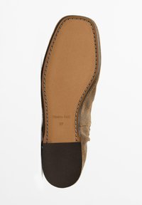 Brown suede shoe sole with a smooth tan leather insole. Features white stitching along the edge and a label marked "Massimo Dutti" and size 37.
