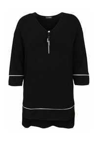 Schwarzes Kurzarmoberteil mit V-Ausschnitt und Reißverschlussdetail, verziert mit weißen Paspeln entlang der Ärmel und dem Saum, aus weichem Material gefertigt.