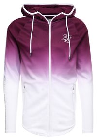 Vetoketjullinen huppari, jossa valkoiset kiristysnauhat, violetista valkoiseen liukuvärjäys, etutaskut vetoketjuilla ja rintakehässä pieni valkoinen kirjailtu logo.