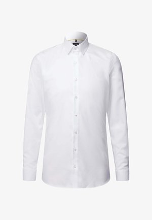 Fehér, hosszú ujjú, pamut ing, gombos gallérral. Előlapján gombos rész található, valamint keskenyített ujjak. Sima tapintású.