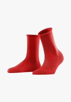 Red ankle socks made of smooth, stretchy material with a ribbed cuff, featuring a reinforced toe and a subtle brand logo on the side.