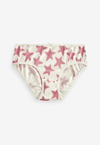 Sous-vêtements en coton présentant un fond crème avec des motifs d'étoiles roses. Taille élastique et ouvertures de jambe avec un détail en nœud décoratif.