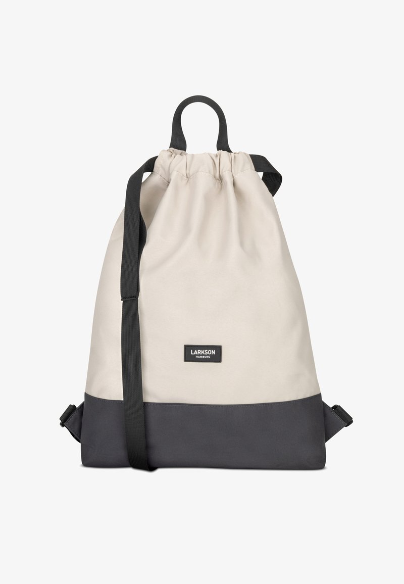 Fűzős hátizsák világos bézs és sötétszürke anyagból. Jellemzői: tetején fogantyú, állítható pántok és logó folt elöl.