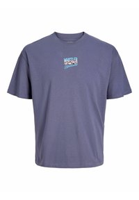 Lilla bomulds-t-shirt med korte �ærmer, der har et lille grafisk motiv med "WHISTLER" og "Blackcomb" i lyseblå og hvid på forsiden.