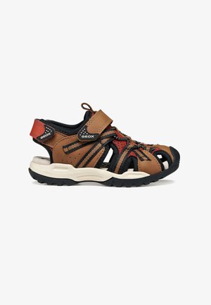Brune og sorte Geox udendørs sandaler med velcroremme, åben tå, røde detaljer, polstret sål og åndbart design til børn.