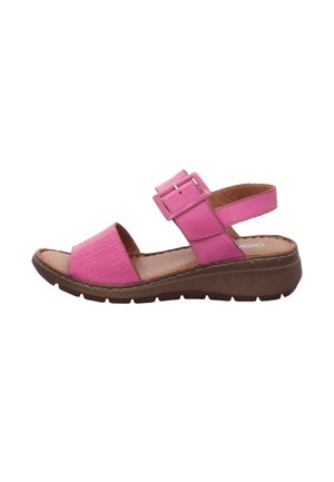 Pink open-toe sandal with textured front strap, adjustable buckle ankle strap, cushioned insole, and thick brown sole for comfort.