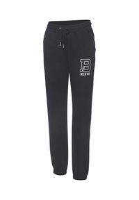 Pantalon de jogging noir avec poignets et ceinture élastiques, poches avant, cordon de serrage, et logo blanc « B MCR'89 » sur la cuisse gauche.