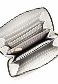 White leather wallet with a zip closure, multiple card slots, a coin pocket, and beige fabric lining. Features gold-tone hardware accents.