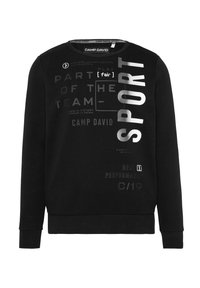 Sudadera negra con cuello redondo, que presenta gráficos de texto en plata y gris. Confeccionada en una tela suave, tiene puños y dobladillo acanalados.