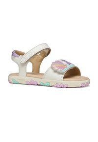 Sandalias de cuero blanco con un adorno de mariposa, correa ajustable y suela con un colorido estampado floral en tonos menta y rosa.