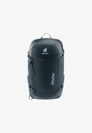 Mochila cinza-escura com um design elegante e arredondado. As características incluem uma superfície texturizada, alças ajustáveis e um logótipo proeminente na parte da frente.