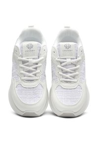 White sneakers with a textured fabric upper and smooth synthetic accents. Features include laces, logo on the tongue, and rounded soles.