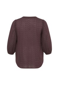 Purple, textured blouse with puffed sleeves and a round neckline; features a subtle pattern and elastic cuffs.