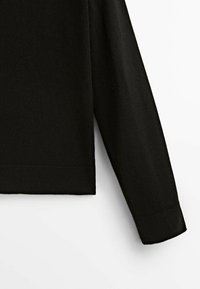 Black pullover sweater with long sleeves, featuring a ribbed hem and cuffs. The texture appears soft and smooth.