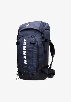 Blue and black backpack with grid pattern, adjustable straps, top lid, and a large front logo. Features multiple pockets and buckles.