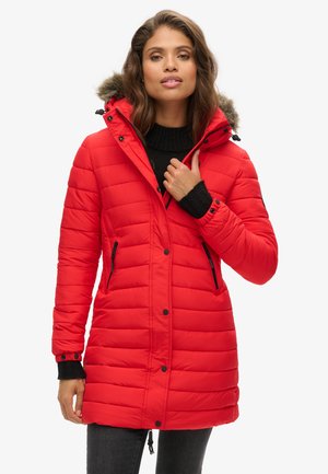 Red padded parka jacket with a detachable fur-lined hood, zippered pockets, black accents, and ribbed cuffs. Smooth texture and mid-length design.