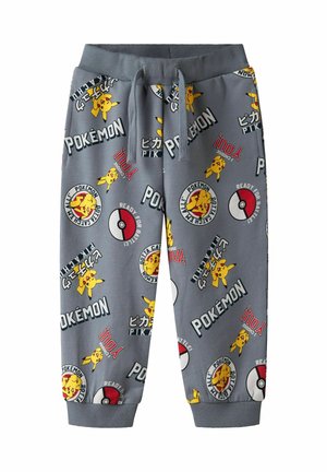 Pantalon de survêtement gris pour enfants avec imprimés Pikachu, Poké Balls et texte Pokémon, avec taille à cordon et poignets côtelés.