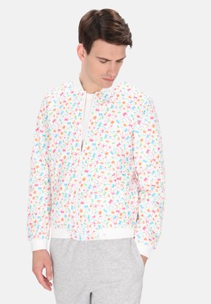 Luchtige bomberjack met een witte achtergrond, versierd met een kleurig, abstract bladerenpatroon. Geribde manchetten en zoom voor een perfecte pasvorm.