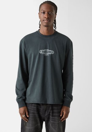 - Bluzka z długim rękawem