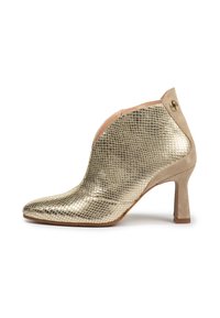 Gold metallic ankle boot with a textured finish, pointed toe, and a smooth beige heel. Features a side button accent and a suede panel.