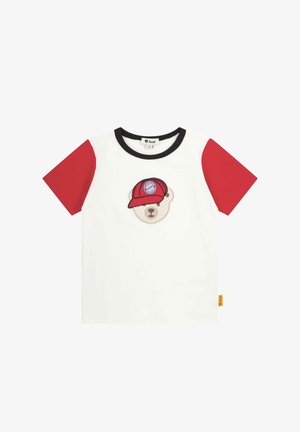 White cotton t-shirt with red short sleeves, featuring a bear wearing a red cap with a logo. Black neckline and small yellow tag on the side.