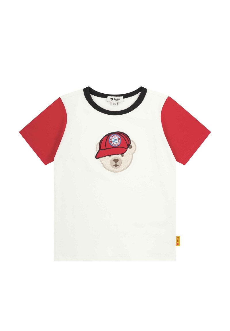 White cotton t-shirt with red short sleeves, featuring a bear wearing a red cap with a logo. Black neckline and small yellow tag on the side.