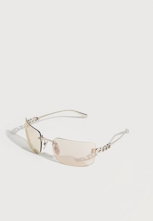 Rimless sunglasses with light beige tinted lenses and thin silver arms featuring chain-link design near the temples.