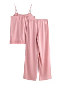 Pajama set in light pink, featuring a camisole with adjustable straps and lace trim, paired with loose-fitting, elastic-waist pants.
