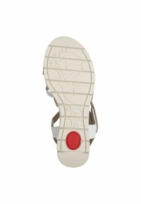 Semelle de sandale blanche avec surface texturée, rainures pour une meilleure adhérence et accent rouge au talon. Les lanières sont visibles, faites d'un matériau léger.