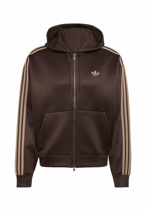 Brązowa bluza z kapturem na zamek błyskawiczny, beżowe trzy paski na rękawach, przednie kieszenie, kaptur ze sznurkiem oraz małe logo Adidas trefoil na piersi.