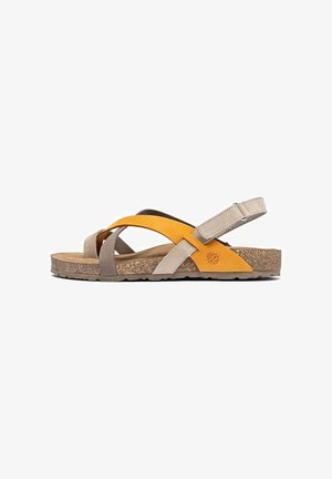 Sandalen met bandjes, gemaakt van bruin, beige en oranje leer, met een kurken zool, een verstelbare achterband en een kruislings ontwerp aan de voorkant.