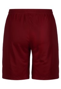 Pantalones cortos deportivos color burdeos, fabricados con tejido suave, que cuentan con una cintura elástica y un corte simple y clásico sin bolsillos visibles ni adornos.