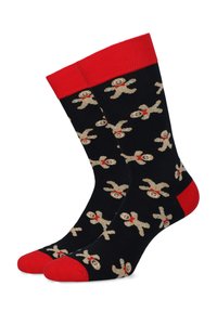 Czarne skarpetki z czerwonymi mankietami i czubkami, z powtarzającym się wzorem w postaci ludzików piernikowych w beżowym i czerwonym kolorze, wykonane z miękkiego materiału dzianinowego.